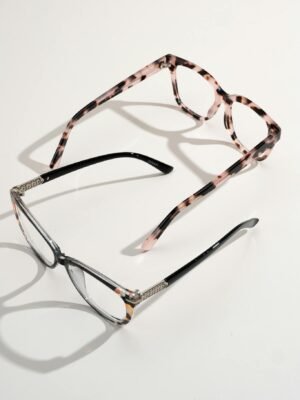 A pair of stylish eyeglasses and sunglasses displayed on a white background.